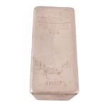 A five kilo silver coloured bar,   stamped Umicore, Feinsilber 999, 5000g, 410387, 16.5cm high