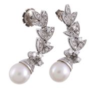A pair of cultured pearl and diamond earrings,   the 9mm cultured pearls with an eight cut diamond