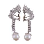A pair of cultured pearl and diamond earrings,   the 9mm cultured pearl with an eight cut diamond