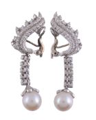 A pair of cultured pearl and diamond earrings,   the 9mm cultured pearl with an eight cut diamond