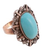 A blue stone and diamond ring,   the central oval shaped blue stone collet set within a pierced