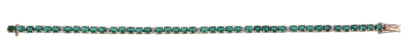 An emerald and diamond bracelet,   the articulated bracelet set with oval shaped emeralds and