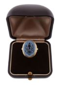 A sardonyx signet ring,   the oval sardonyx panel carved with a crest, stamped 585, finger size K