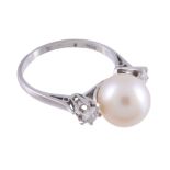 A cultured pearl and diamond ring,   the central 10mm cultured pearl between two claw set brilliant