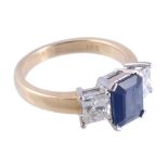 A sapphire and diamond ring,   the central rectangular shaped sapphire in a four claw setting,