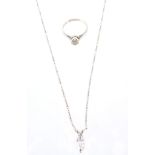 A diamond pendant and a diamond ring,   the marquise cut diamond in a pendant setting,
