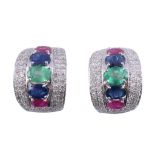 A pair of ruby, sapphire, emerald and diamond earrings,   the central oval shaped emerald between