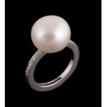 A cultured pearl and diamond ring,   the 12.8mm cultured pearl between brilliant cut diamond  set