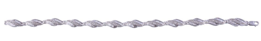 A diamond bracelet,   the bracelet with tonneau shaped panels set with baguette and eight cut