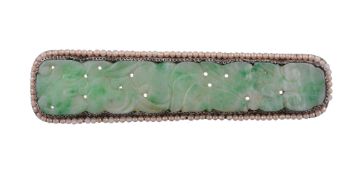 A carved jade pendant and brooch  , the pendant with a carved foliate jade panel suspended from a