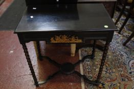 A late 17th Century style ebonised table on barley twist legs joined by an x-stretcher 73cm high,