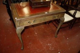 A Georgian style mahogany writing table on shell carved cabriole legs 94cm wide
