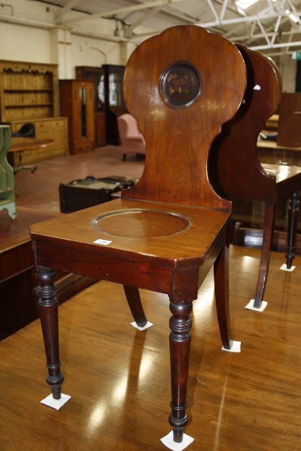 A pair of mahogany late Georgian hall chairs bearing Boars Head to back, possibly from the Duke of