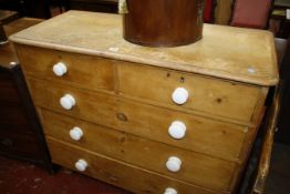 A Victorian pine chest with two short and three long drawers on turned feet 105cm wide