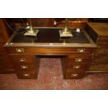 A 19th Century military style pedestal desk with seven drawers 112cm wide