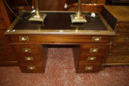 A 19th Century military style pedestal desk with seven drawers 112cm wide