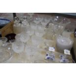 A quantity of assorted glassware, to include decanters, cut glass bowls, table salts and plates,