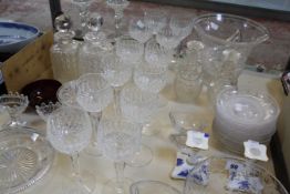 A quantity of assorted glassware, to include decanters, cut glass bowls, table salts and plates,