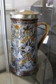 A Doulton stoneware silver-plate mounted jug by Florence Barlow, 24cm high