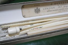 A mother of pearl and lace fan in original box, six chopsticks, a crochet hook and an ivory