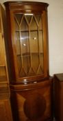 A reproduction yew wood corner cabinet and a bookcase