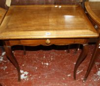 A French provincial walnut side table with a frieze drawer on cabriole legs 73cm wide