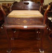 An Edwardian piano stool, with hinged seat