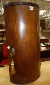 A George III mahogany bowfront hanging cupboard enclosing shelves 61cm high