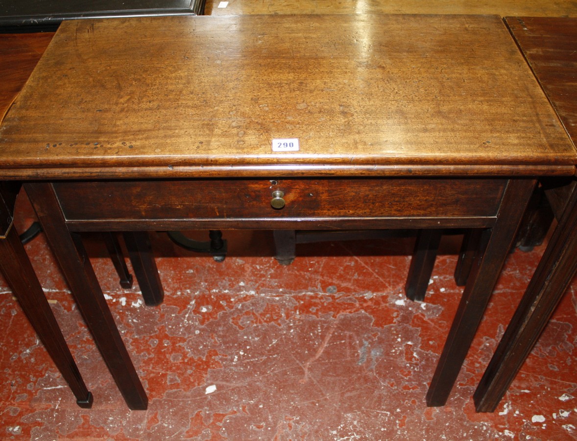 A George III and later tea table with a frieze drawer on square section and chamfered legs 77cm wide