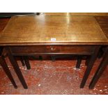 A George III and later tea table with a frieze drawer on square section and chamfered legs 77cm wide