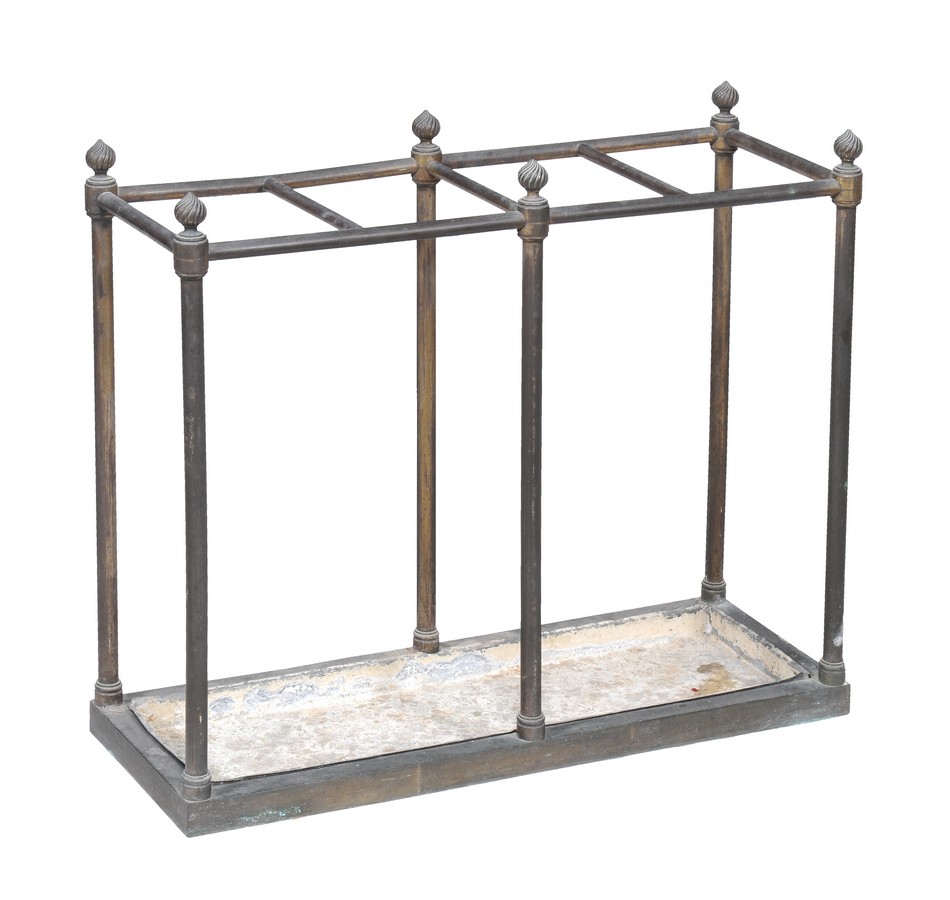 A brass stick stand, 19th century, with gadrooned twist finials above four sections and pillar