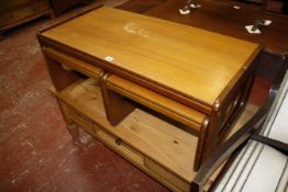 *A pine coffee table and a nest of teak coffee tables