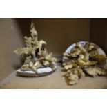A pair of giltwood wall brackets decorated with birds and oak leafs