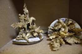 A pair of giltwood wall brackets decorated with birds and oak leafs