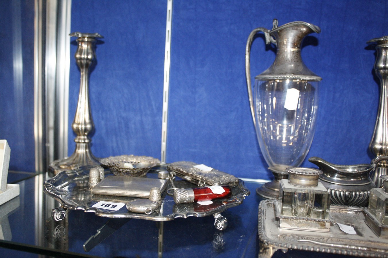 A collection of silver items to include; an oblong inkstand with two glass bottles, a silver-mounted