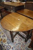 An oak gateleg table 96cm wide