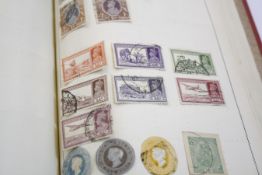 A ‘Movaleaf’ stamp album of World Wide stamps and folder of loose stamps and envelopes