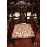 A George III mahogany chair with eagle arm supports and drop in seat