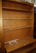 A teak open bookcase with lower panelled cupboard 103cm wide