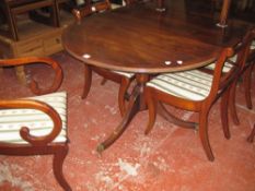 A Regency style mahogany twin pedestal dining table with one additional leaf 245cm length with eight