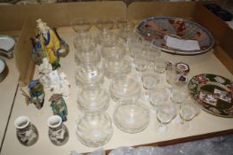 Ten etched glass finger bowls, twelve wine glasses, matching larger glasses and a pair of thistle