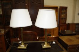 A pair of brass column table lamps (sold as parts