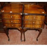 A pair of 19th Century style mahogany bedside tables each with three drawers on slender cabriole