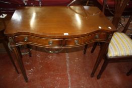 A pair of George III style mahogany dining chairs and a mahogany serpentine fronted serving table