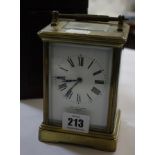 A two-train carriage clock with leather carrying case, retailed by Mappin & Webb, London