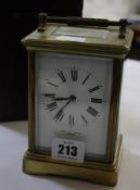 A two-train carriage clock with leather carrying case, retailed by Mappin & Webb, London