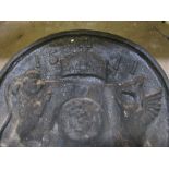 A cast iron fire back in 16th century style and a cast iron dog grate Best Bid