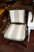 A Regency style mahogany finish armchair, a piano stool and wine table