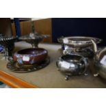 A mixed lot of silverplate, to include a four piece tea set and decorative serving bowls.