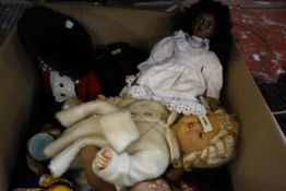 A collection of dolls, including a Shirley Temple doll, gollies, teddy bears and loose dolls clothes